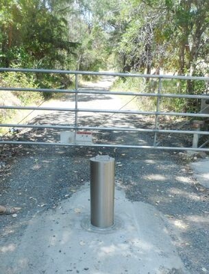 Customizable bollards including reflective strips for visibility providing safety solutions in pedestrian walkways and bike lanes